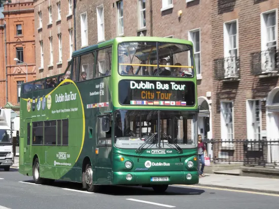Green open top tour bus in Dublin